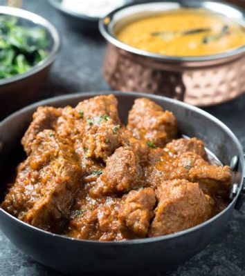  Laal Maas: An Aromatic Explosion of Tender Lamb Infused with Fiery Spices and Creamy Yogurt!